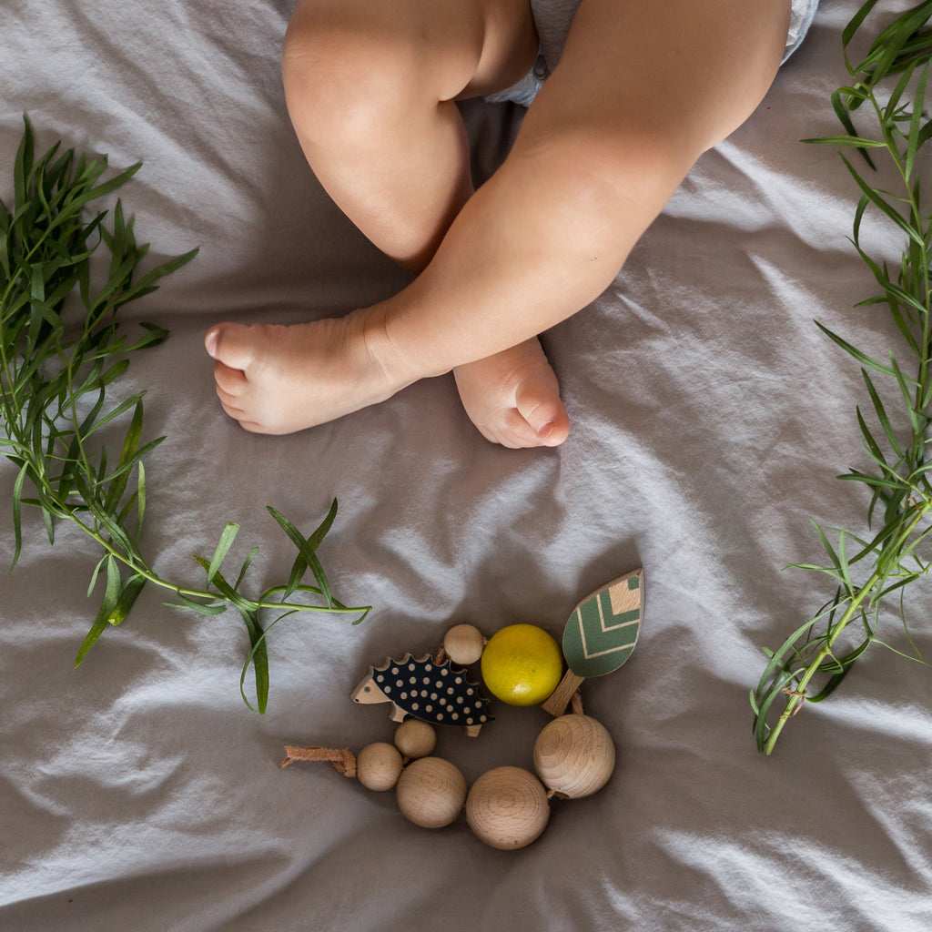 Baby playing with Eperfa wooden teether