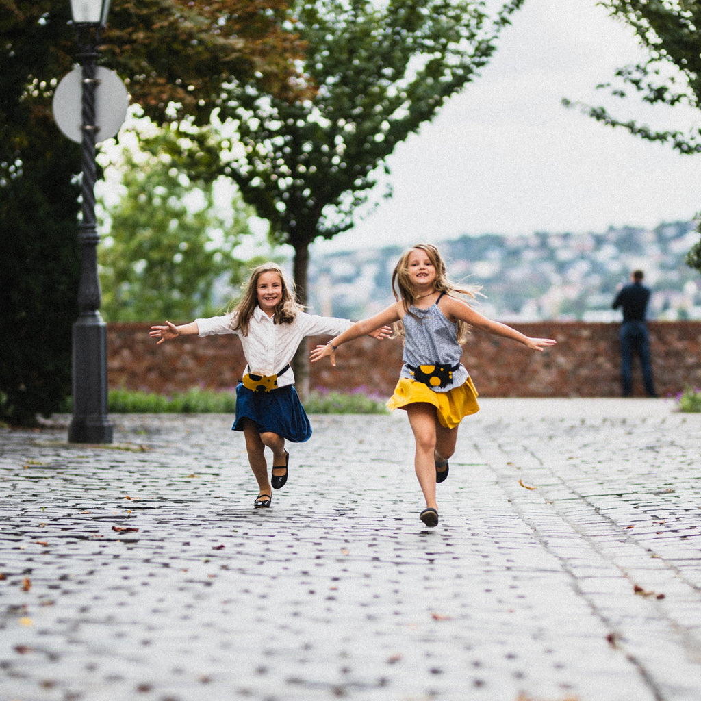 Children wearing Eperfa leather belt bags pig