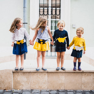 Children wearing Eperfa leather belt bags