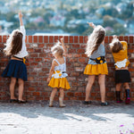 Children wearing Eperfa leather belt bags