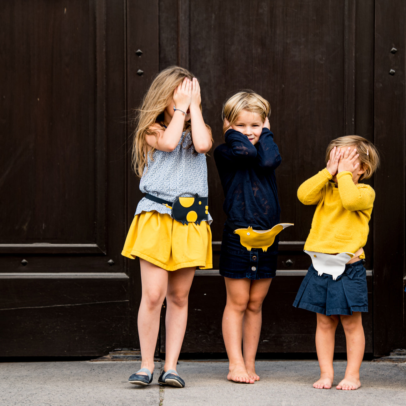 Children wearing Eperfa leather belt bags