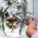 Baby playing with Eperfa wooden teether