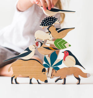 Child playing with Eperfa wooden hillside animals set